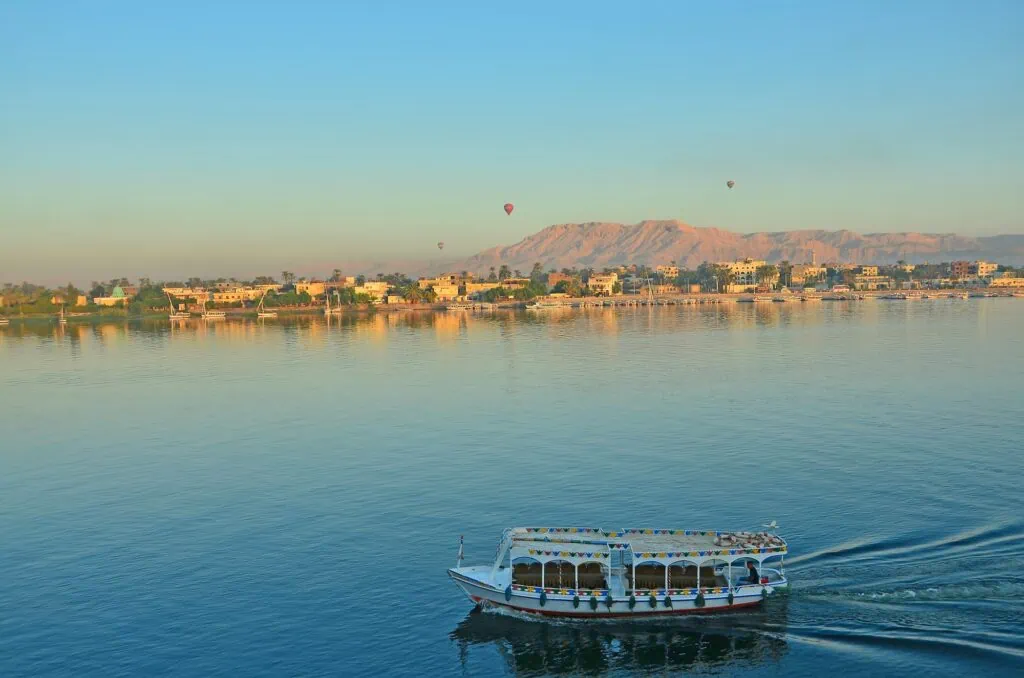 Hot air balloons above the Nile River at dawn, Luxor