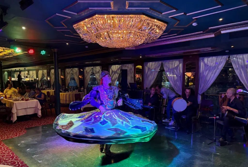 Traditional dancer performing on the Maxim dinner cruise boat on the Nile River, Cairo
