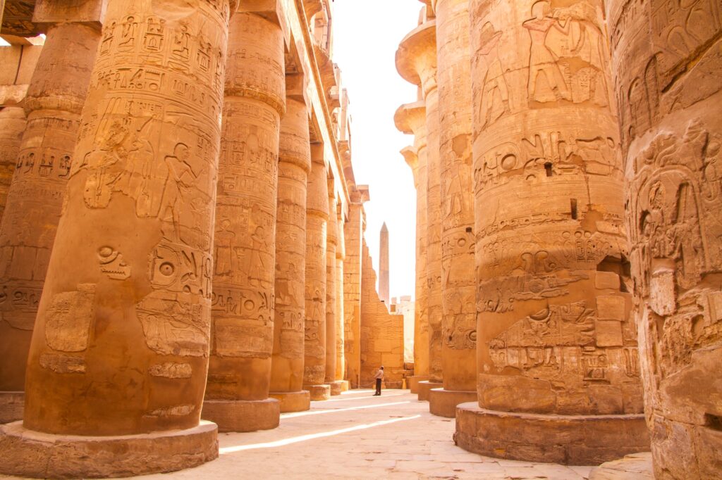 Ruins of the ancient Karnak Temple with towering columns in Luxor