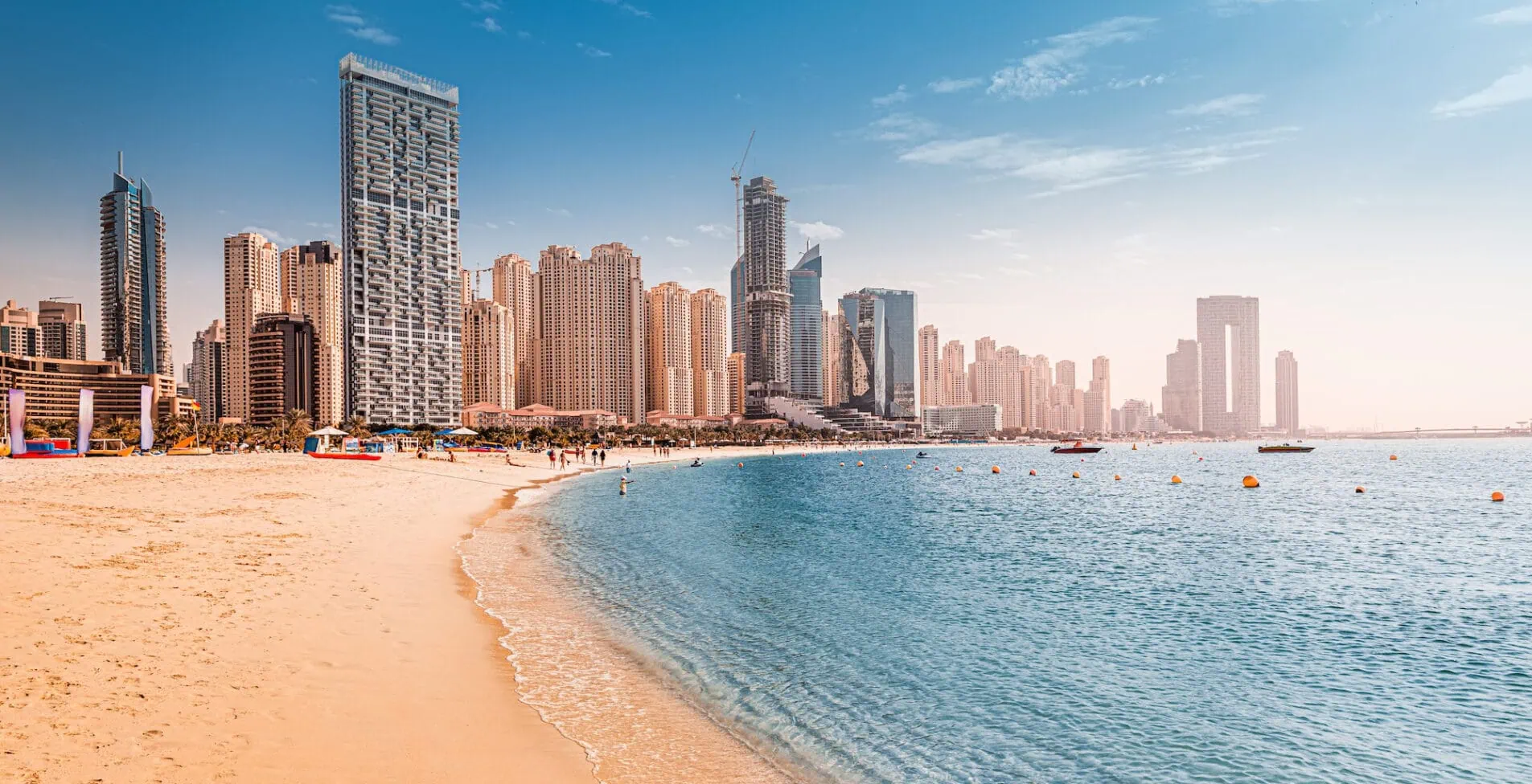Luxurious sandy beach in the Dubai Marina area with views of the iconic skyscrapers and the warm waters of the Persian Gulf 1905x976 crop 48 27