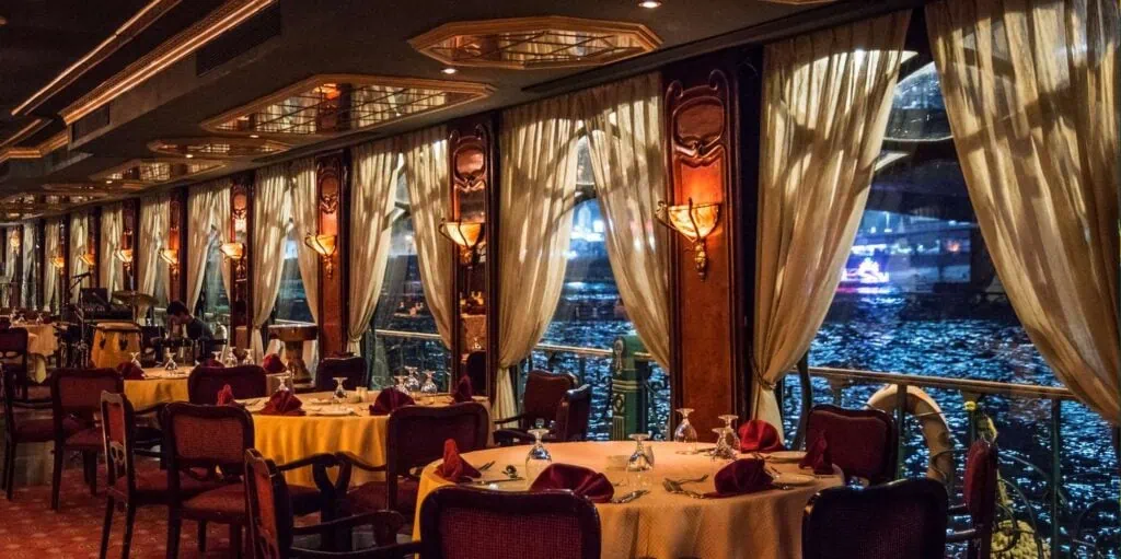 Dining tables on the Maxim dinner cruise overlooking the Nile