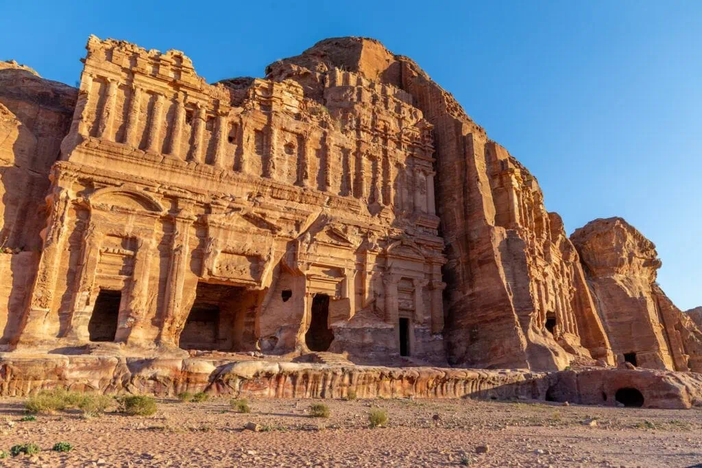 Palace Tomb multi-level rock-cut facade with columns carved into a sandstone cliff Petra