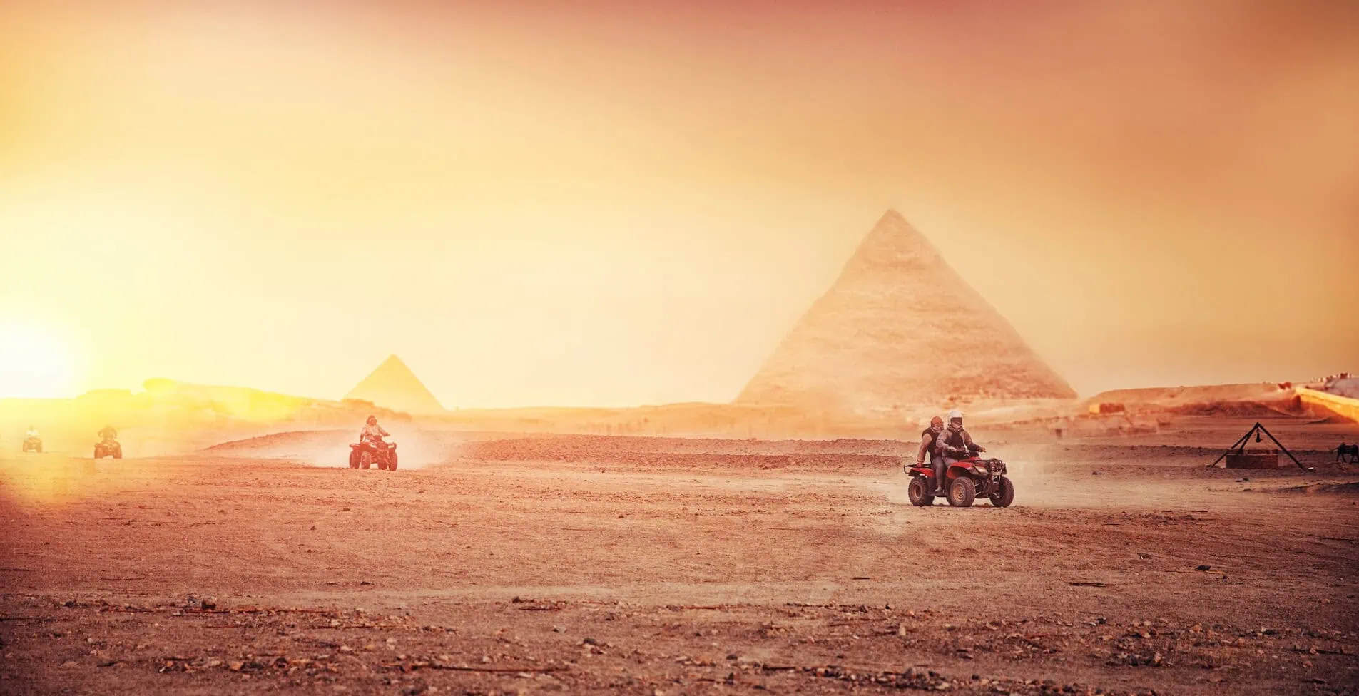 Quad bikes ATV safari in desert background Pyramids Sphinx Cairo 1905x976 crop 52 43