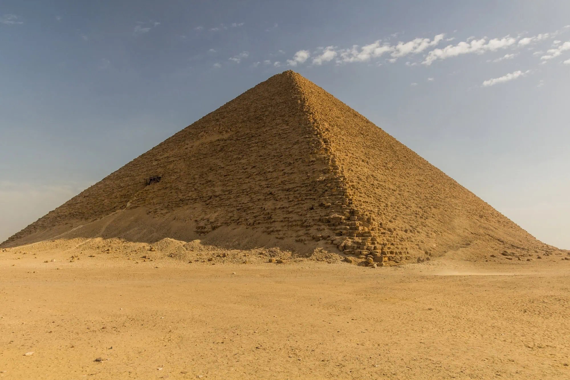 The Red Pyramid at Dahshur showing its complete triangular structure in desert landscape