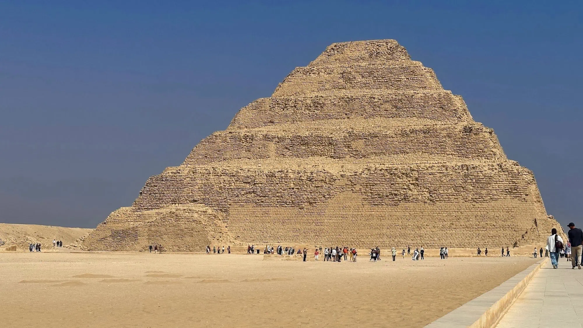 Step Pyramid of Djoser at Saqqara with tourists at the base
