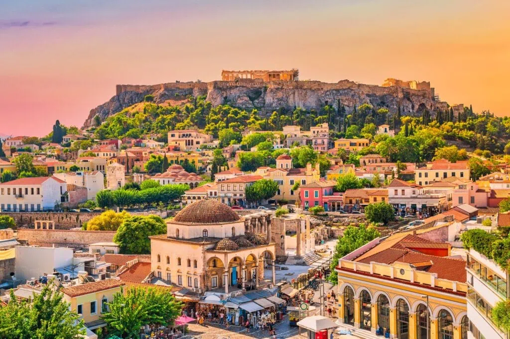 Sunset view of Monastiraki Square with the Acropolis Hill rising above the city skyline in Athens