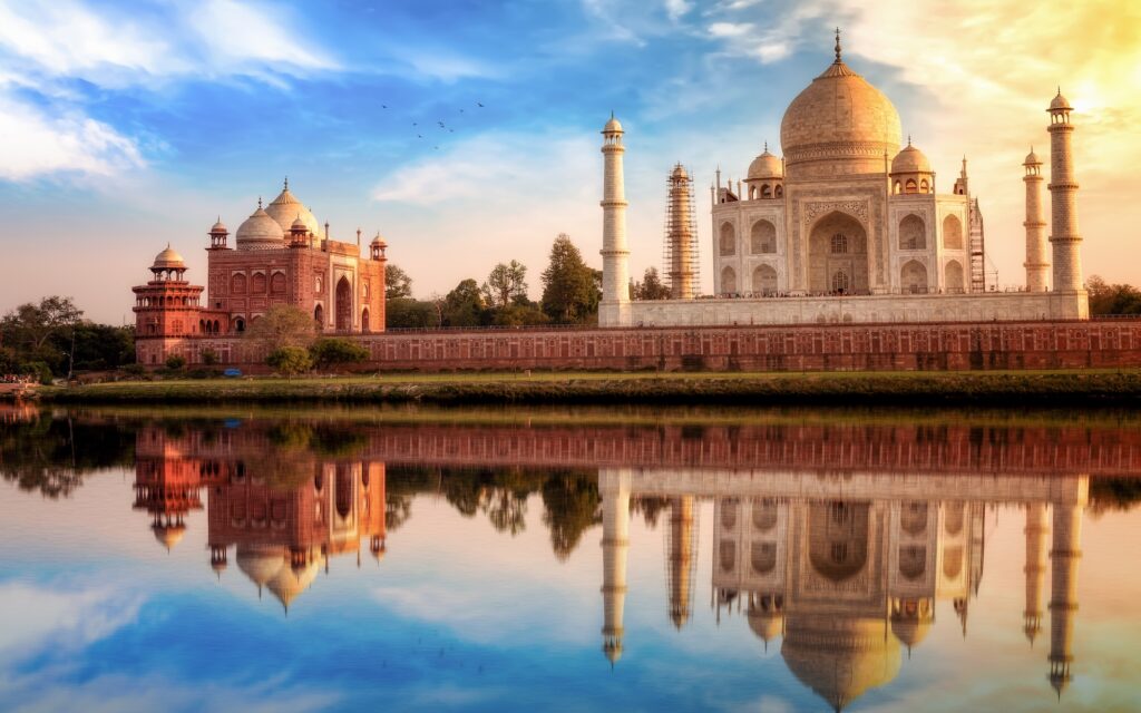 Taj Mahal India at sunset with water reflection. Taj Mahal is a UNESCO World Heritage site at Agra on the banks of river Yamuna