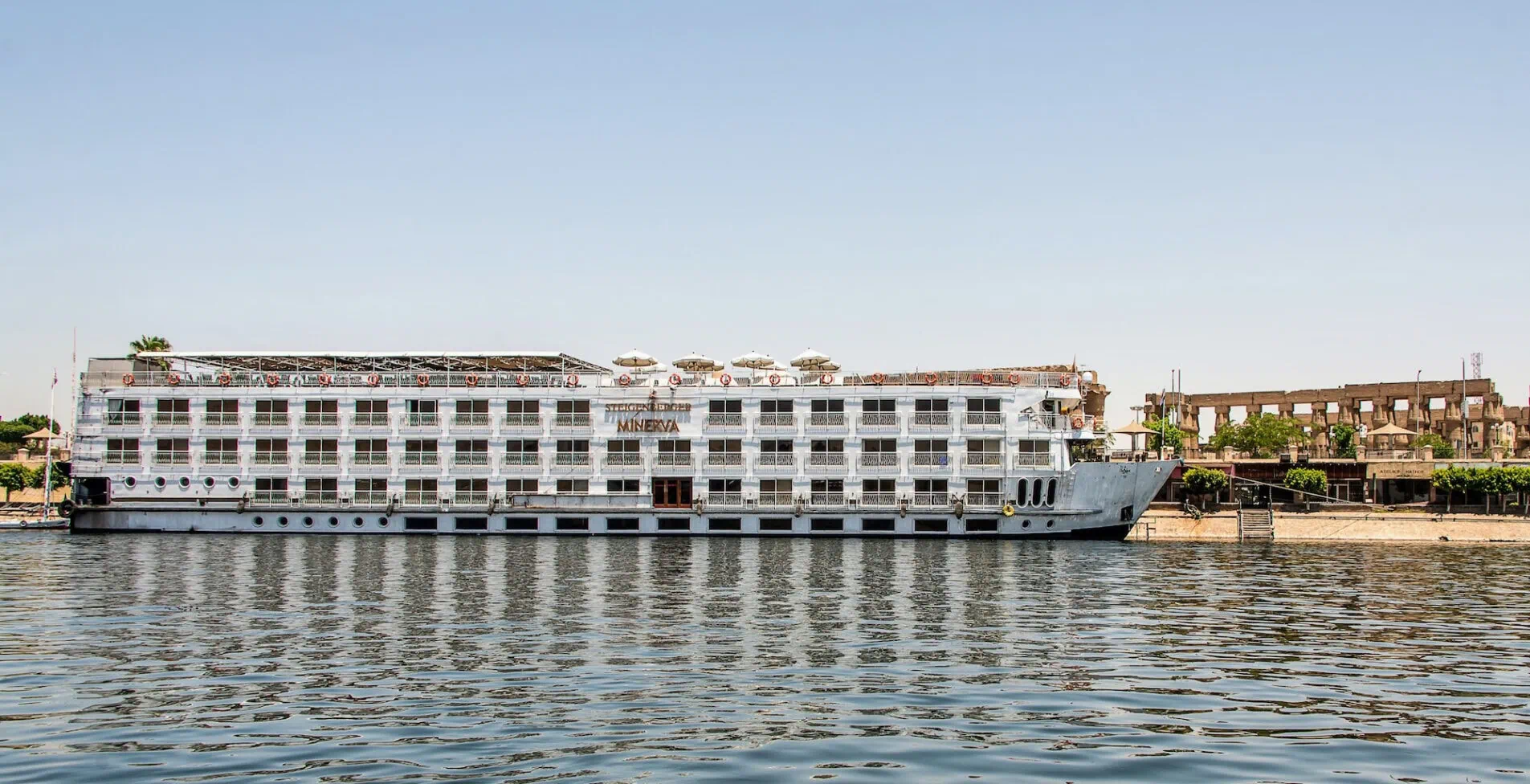 View on the Nile River with the Steigenberger Minerva Cruise Boat Hotel on West Bank 1 1905x976 crop 43 53