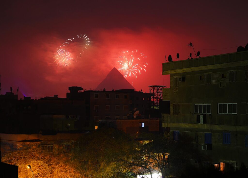 Fireworks and light displays over the pyramids during New Year's celebrations, Giza