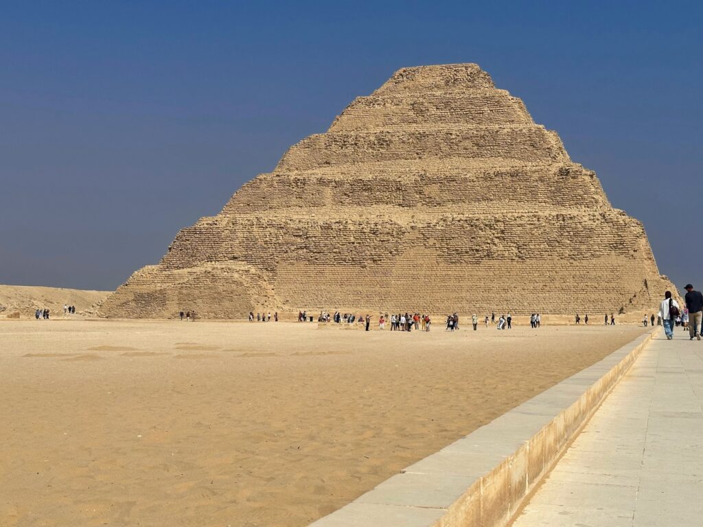 Step Pyramid of Djoser with its tiered limestone structure rising above the desert plateau at Saqqara, Saqqara