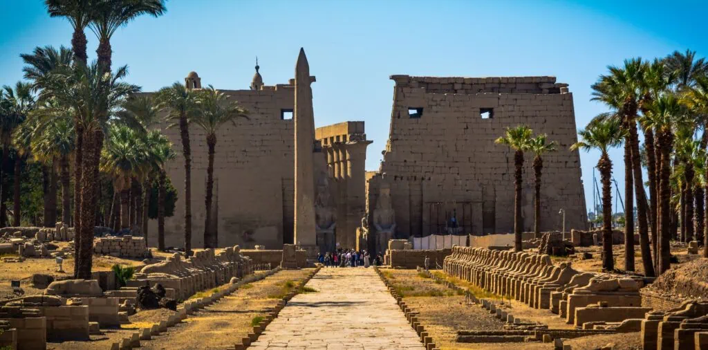 A scenic shot of a road leading to the Luxor Temple in Egypt