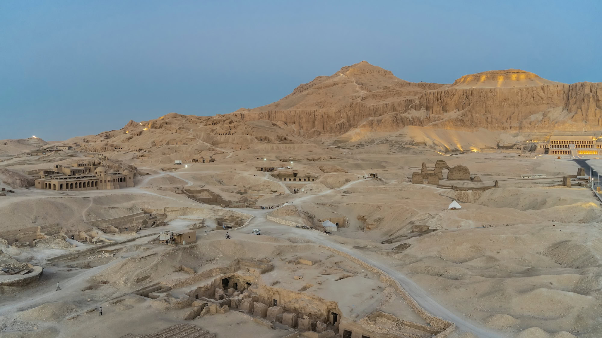 Archaeological site in Valley of the Kings showing ancient ruins and tourists