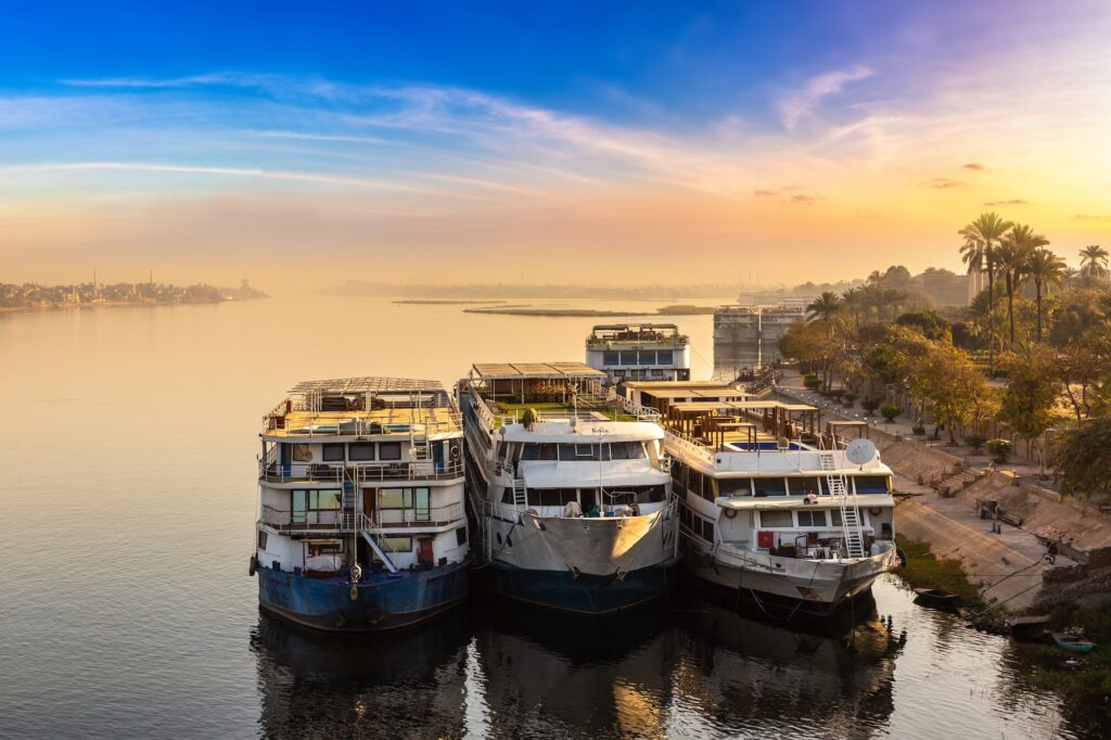 Boat on Nile at sunset in a summer evening