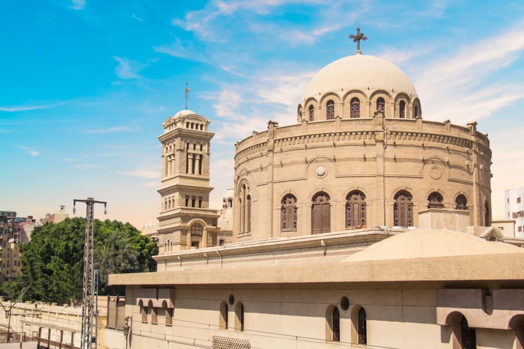 An exterior view of the circular stone structure and surrounding courtyard of the Church of Saint George, Coptic Cairo, Cairo