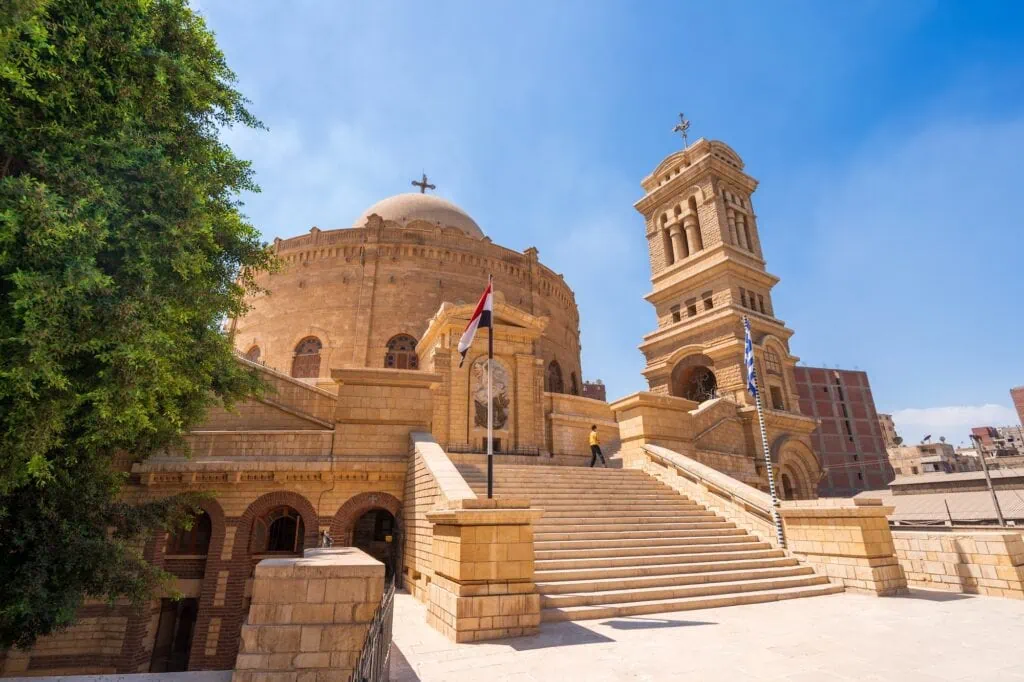 An exterior view of the historic circular stone structure of Saint George Church, Cairo