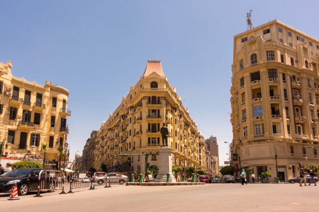 View of Talaat Harb Square with surrounding historic buildings, traffic, and public space in downtown Cairo, Cairo