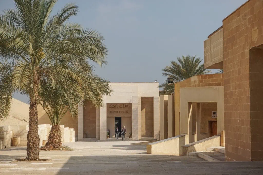 Palm trees lining a paved walkway leading to the modern entrance building, Imhotep Museum, Saqqara