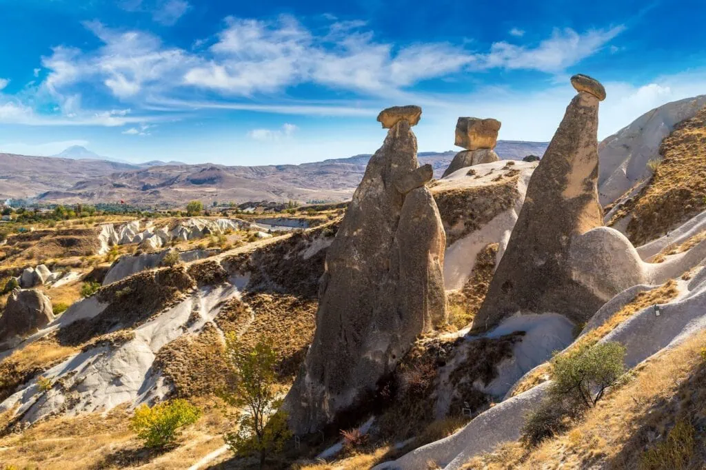 Three Graces (Three Beautifuls) rock hills in Devrent valley in Cappadocia, Nevsehir, Turkey in a beautiful summer day