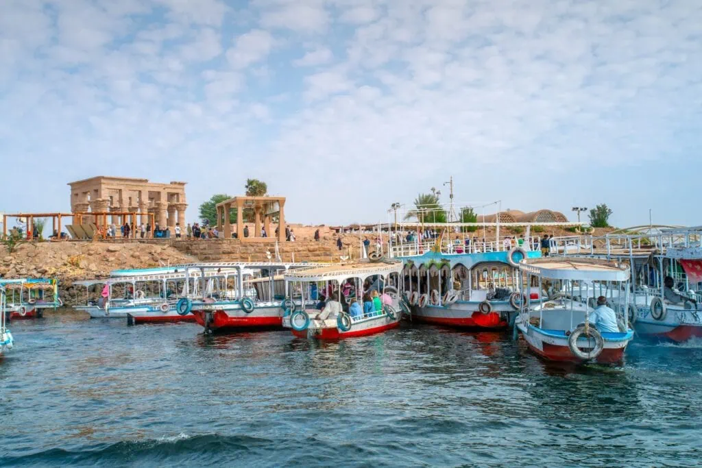 Tourists traveling by boat across Lake Nasser to visit Philae Temple, Aswan
