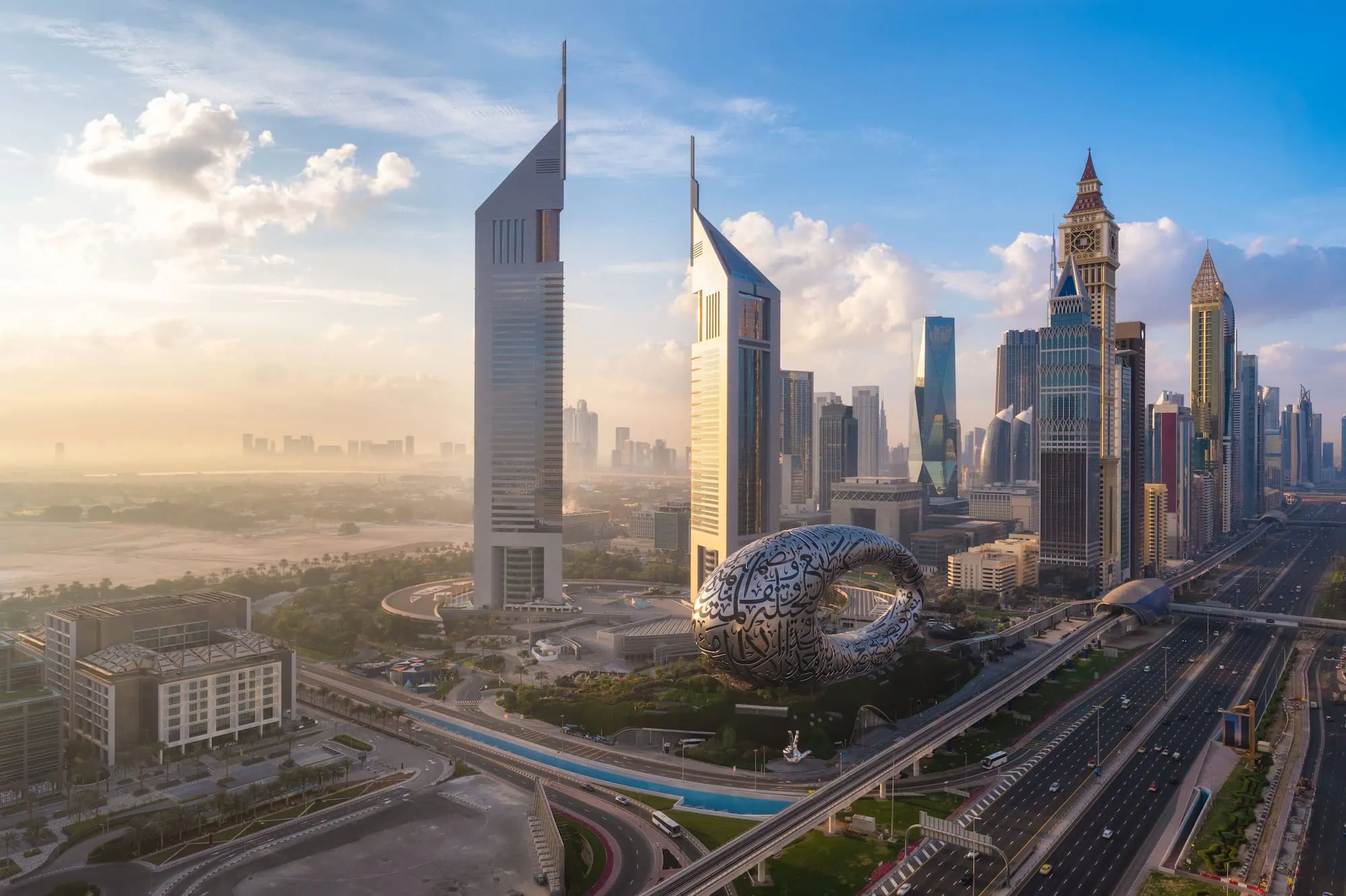 Aerial view of Dubai's modern skyline including Museum of the Future and skyscrapers