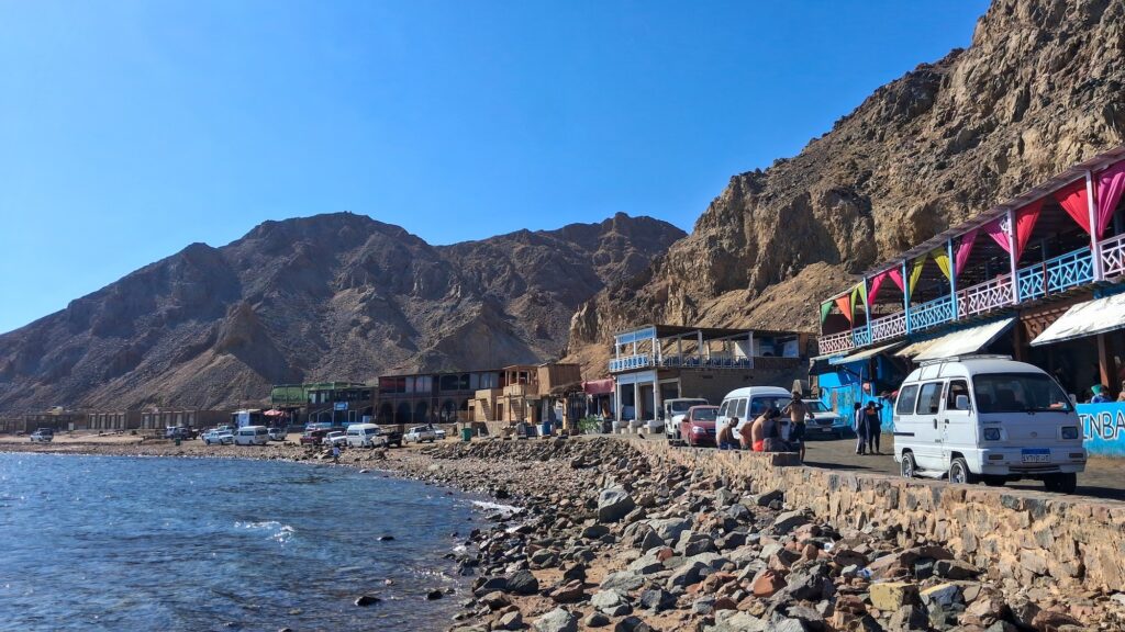 Blue Hole beach with clear waters and surrounding mountain landscape, Dahab