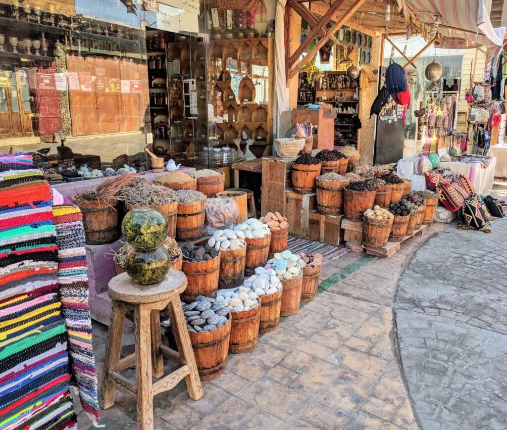 Outdoor spice market with colorful displays of herbs and seasonings, Dahab