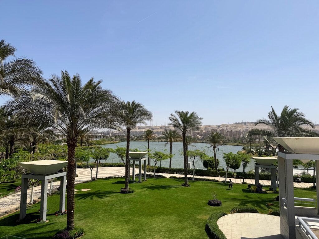 Palm-lined lakeside garden overlooking the landscape at the National Museum of Egyptian Civilization
