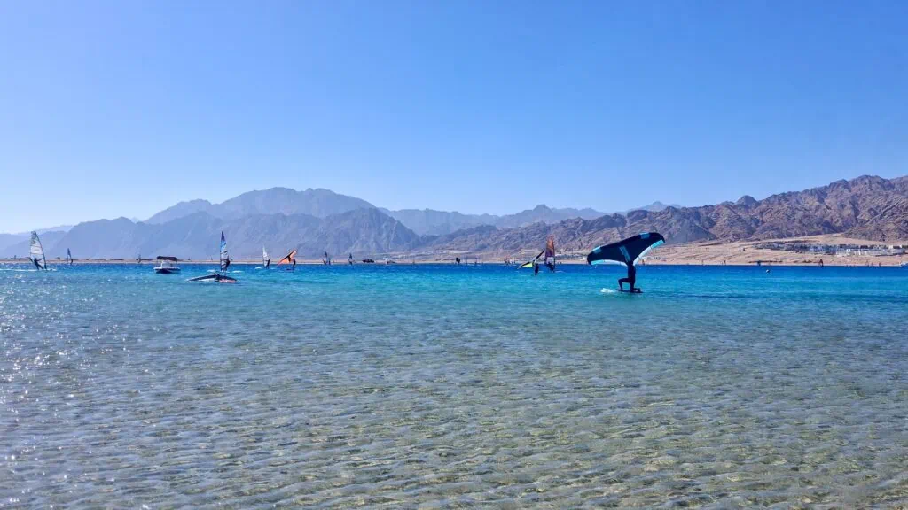 Laguna Beach with windsurfers and kitesurfers on the lagoon waters, Dahab