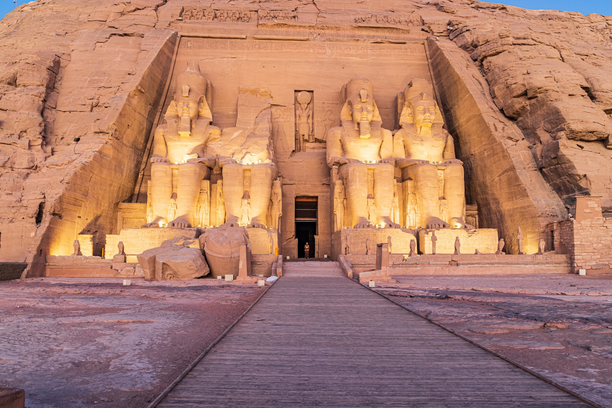 Abu Simbel Aswan Egypt. February 23 2022. Lights on the colossal statues of the Great Temple of Ramesses II in early morning