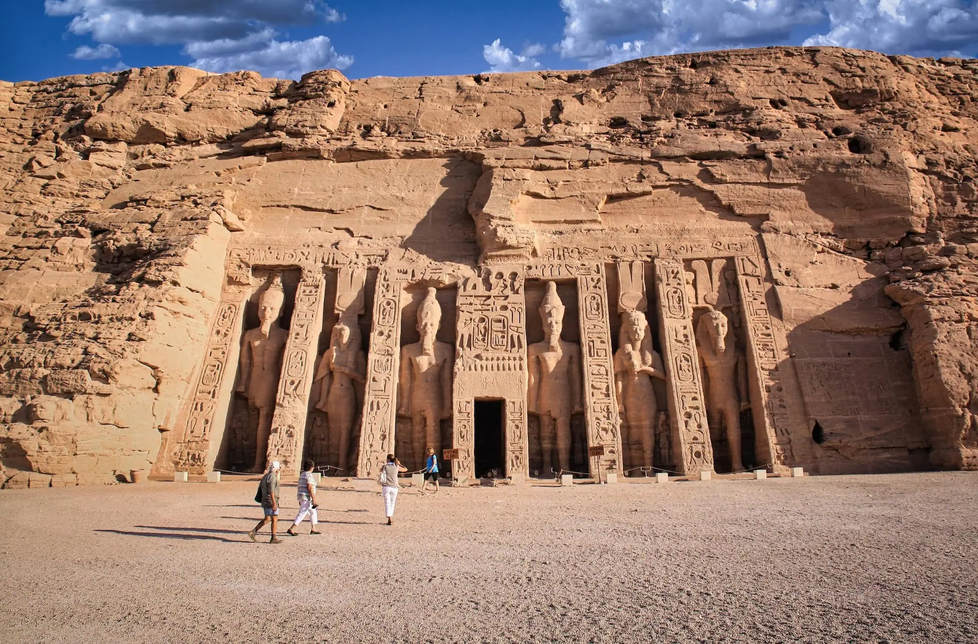 Visitors at the Small Temple of Abu Simbel, dedicated by Ramses II to his queen Nefertari and the goddess Hathor, one of the two rock-cut temples in Egypt's far south reached on longer 10 to 12-day itineraries.