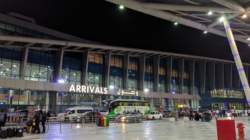 Arrivals Hall of Terminal 2 at Cairo International Airport with Arabic and English signage, Cairo