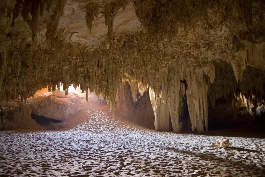 Djara Cave interior showing limestone chambers with stalactite and stalagmite formations in the Western Desert, Farafra