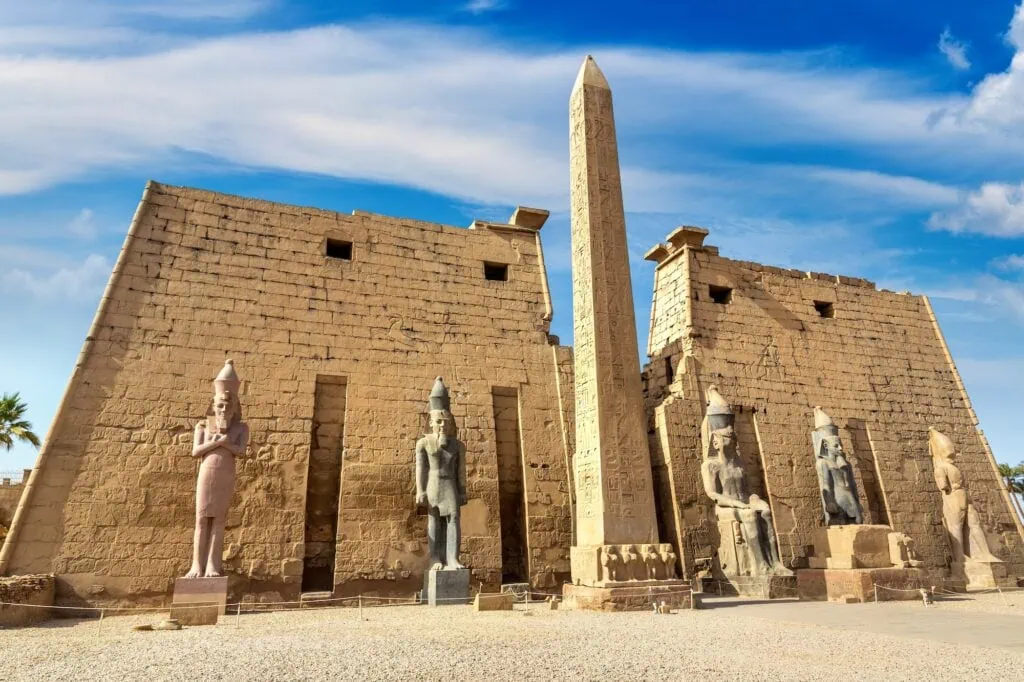 Columns and statues illuminated at the entrance of Luxor Temple, Luxor