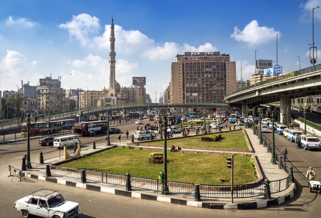 Street view of traffic and surrounding buildings at Ramses Square near Al-Fath Mosque, Cairo