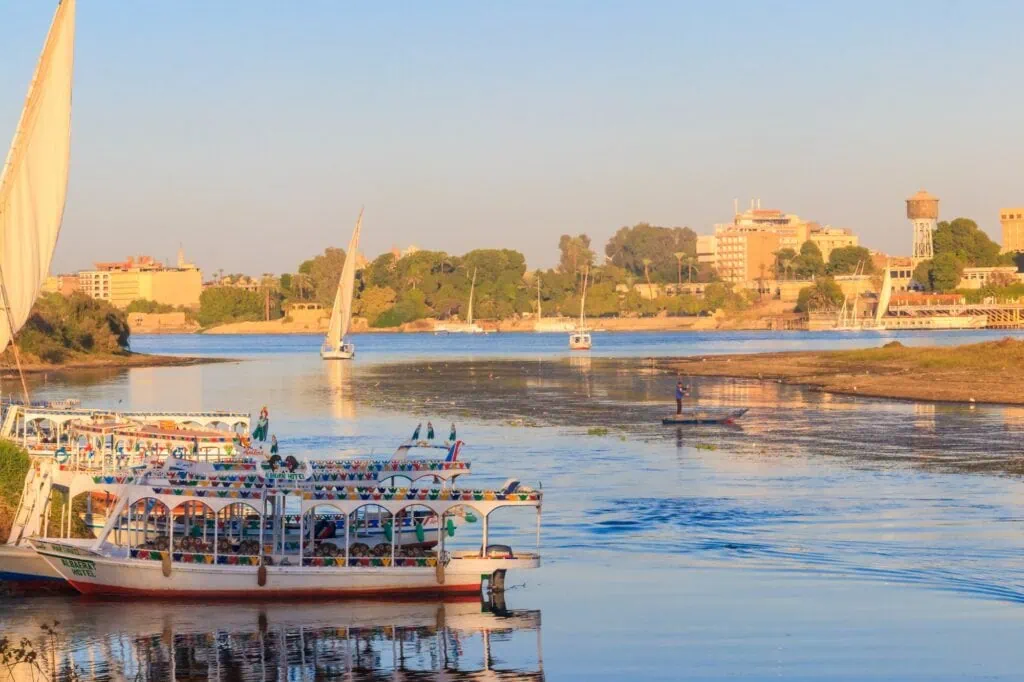 View of the Nile River with boats and riverbanks, Luxor