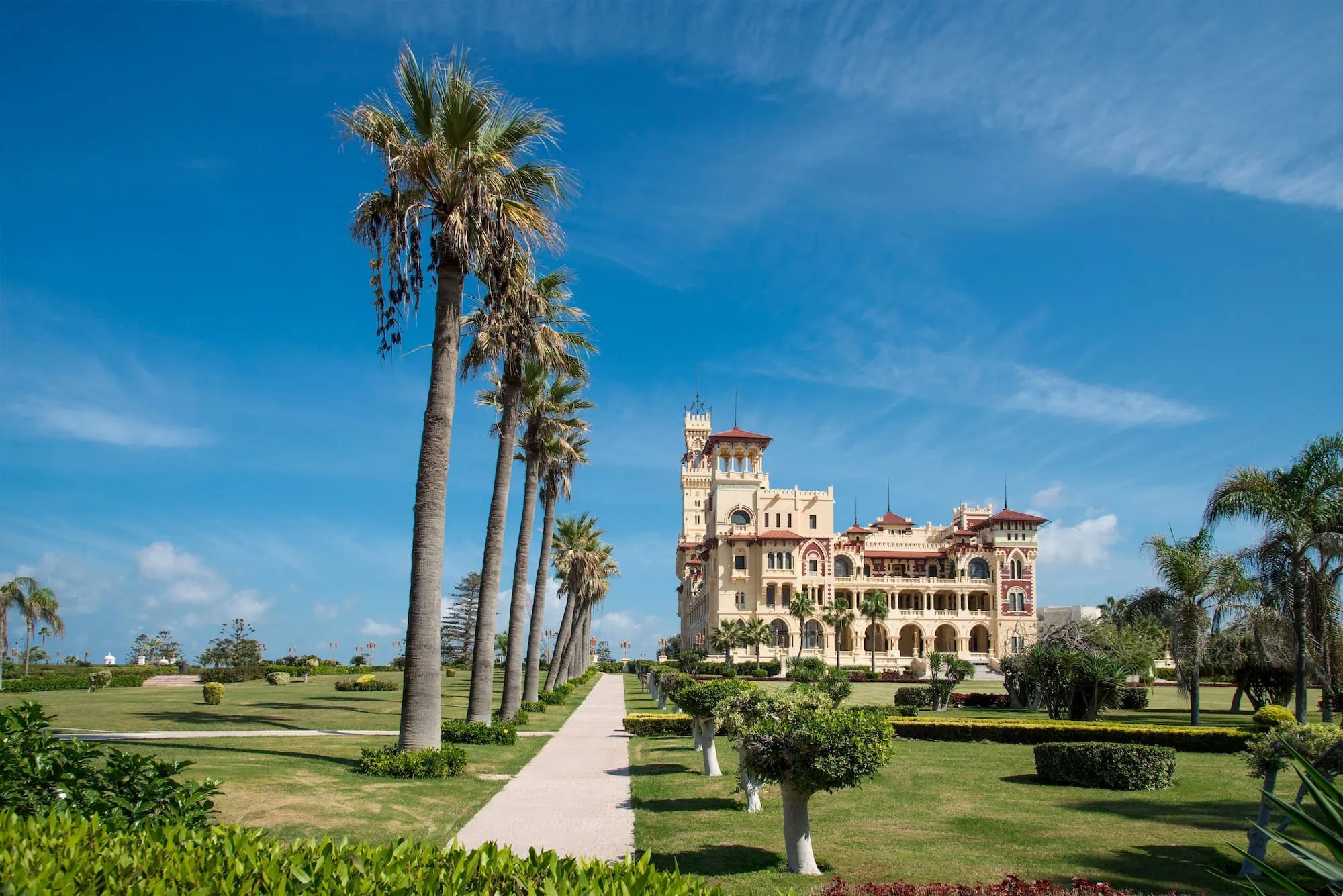 Panoramic view of Montazah Palace in Alexandria with ornate architecture and manicured gardens