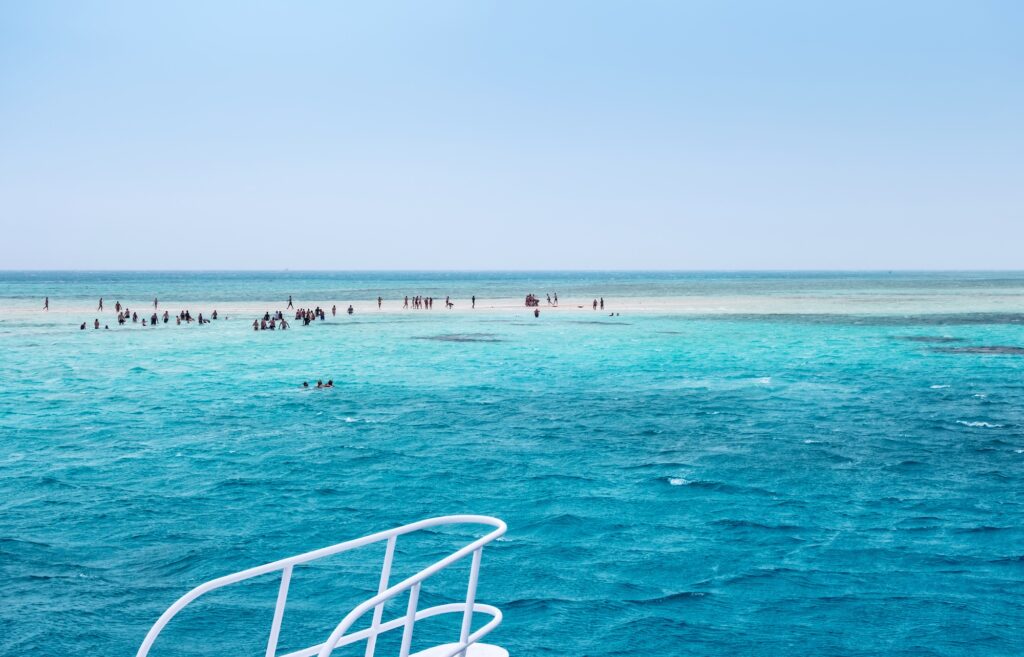 White Island sandbank surrounded by clear blue waters during a snorkeling boat trip at Ras Mohammed National Park, Sharm El Sheikh