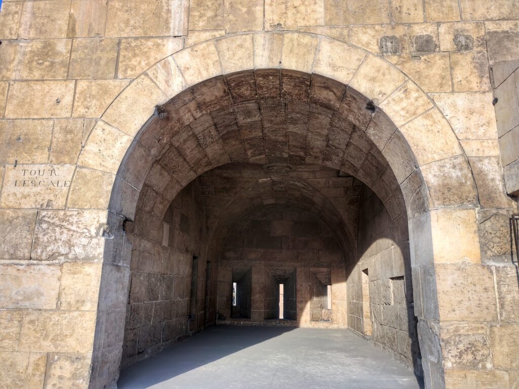 Defense rooms above Bab al-Futuh overlooking Al-Muizz Street with stone vaults and narrow openings, Bab al-Futuh, Cairo