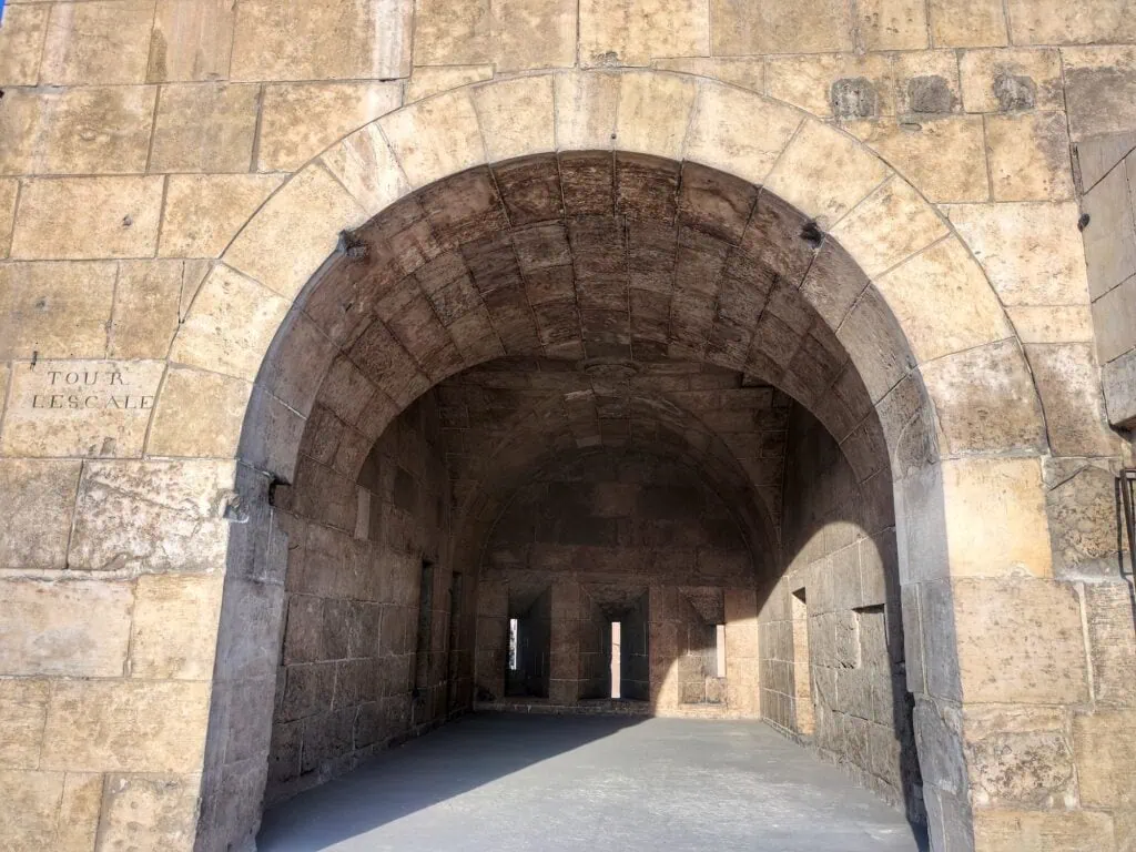 Defense rooms above Bab al-Futuh overlooking Al-Muizz Street with stone vaults and narrow openings, Bab al-Futuh, Cairo