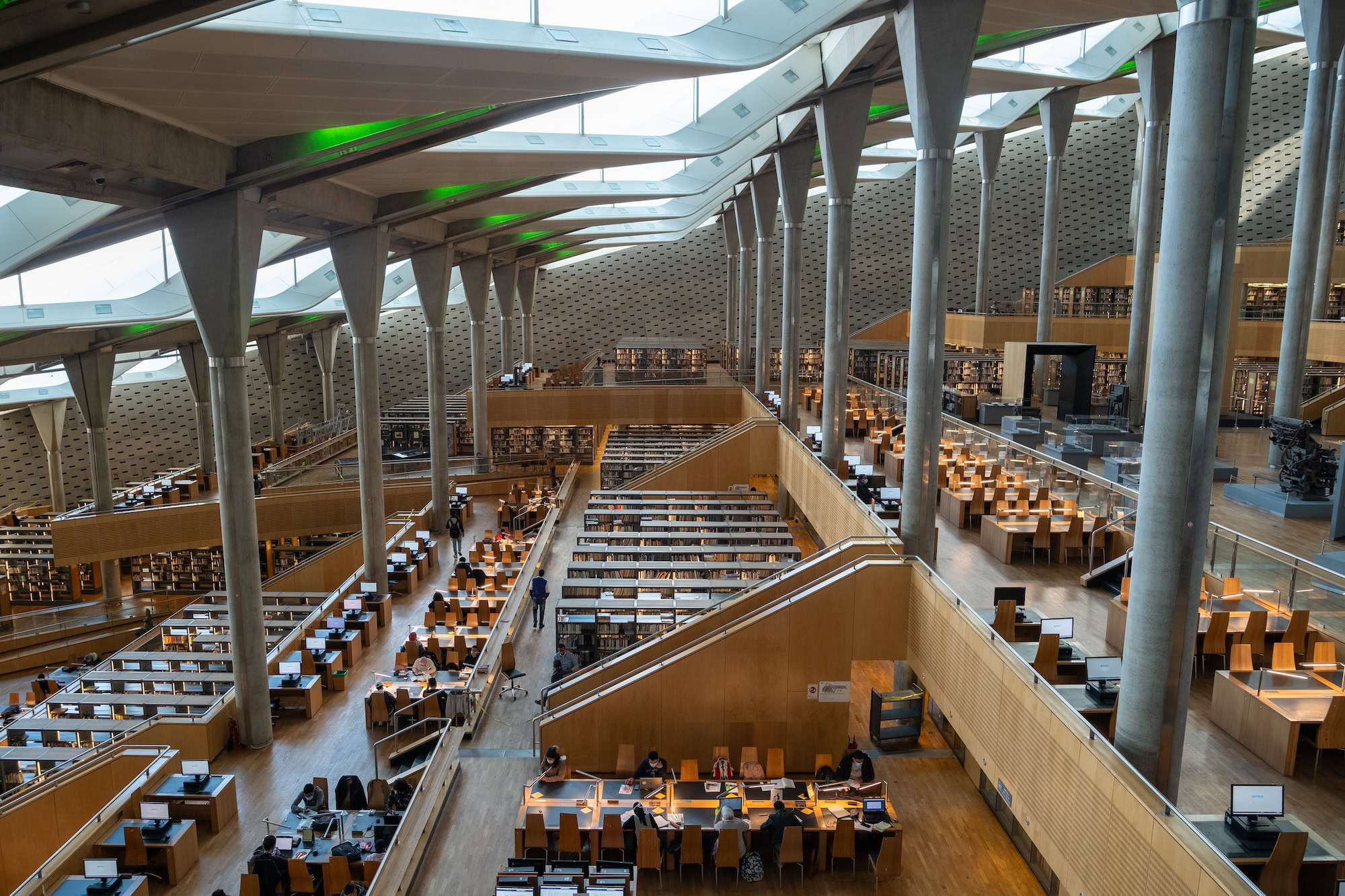 Interior of Bibliotheca Alexandrina showing terraced reading areas and geometric ceiling