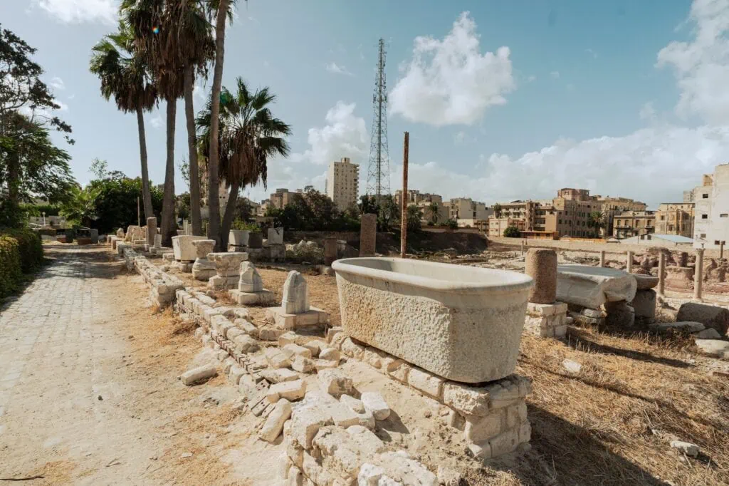 Ancient Roman artifacts displayed within the El Shatby Tombs archaeological site, Alexandria