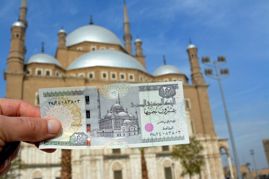 Great Mosque of Muhammad Ali Pasha viewed from an Egyptian 20 pound banknote with the real mosque blurred in the background, Cairo