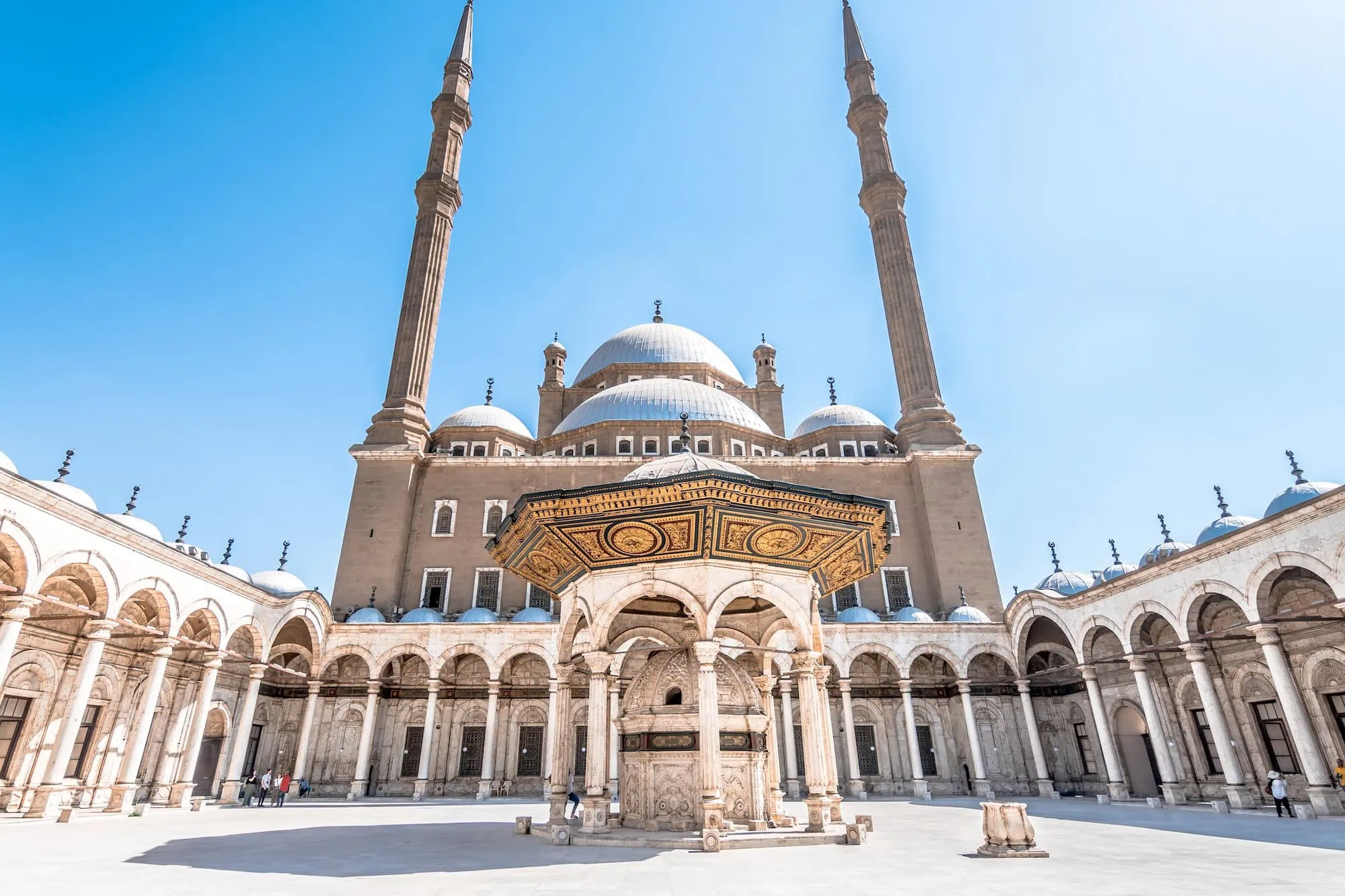 Interior courtyard of Muhammad Ali Mosque with ornate fountain and columns