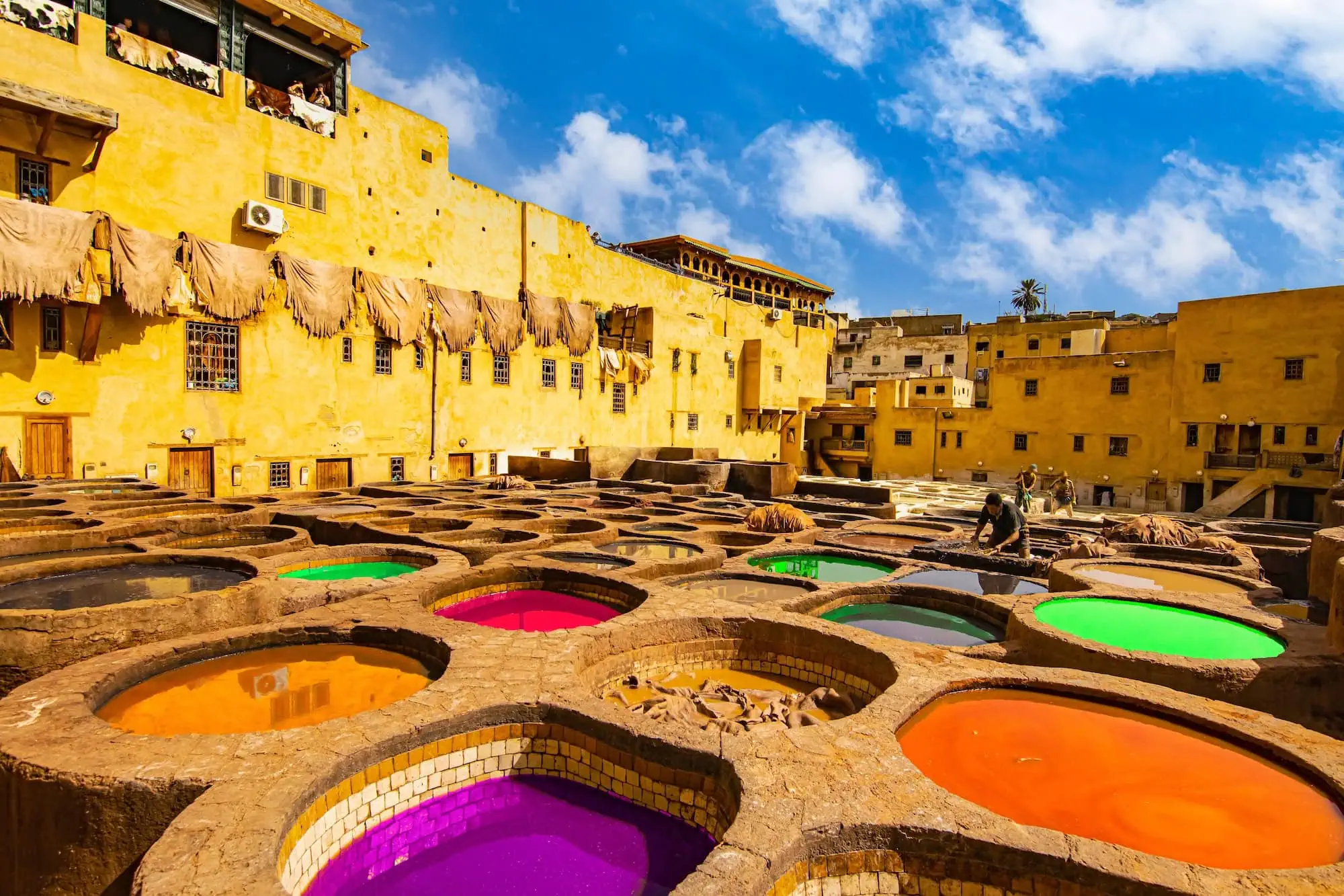 Colorful stone vats filled with dyes at the famous Fes leather tanneries
