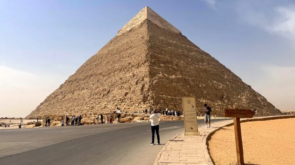 Road leading toward the Pyramid of Khafre with desert surroundings