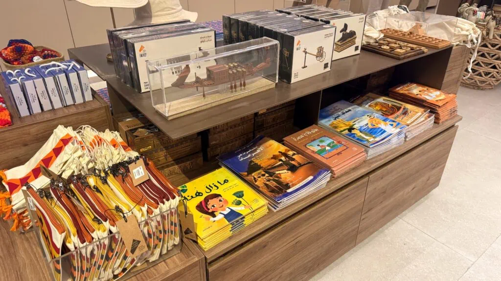 Shelves displaying children's souvenirs and toys inside the Grand Egyptian Museum shop Cairo