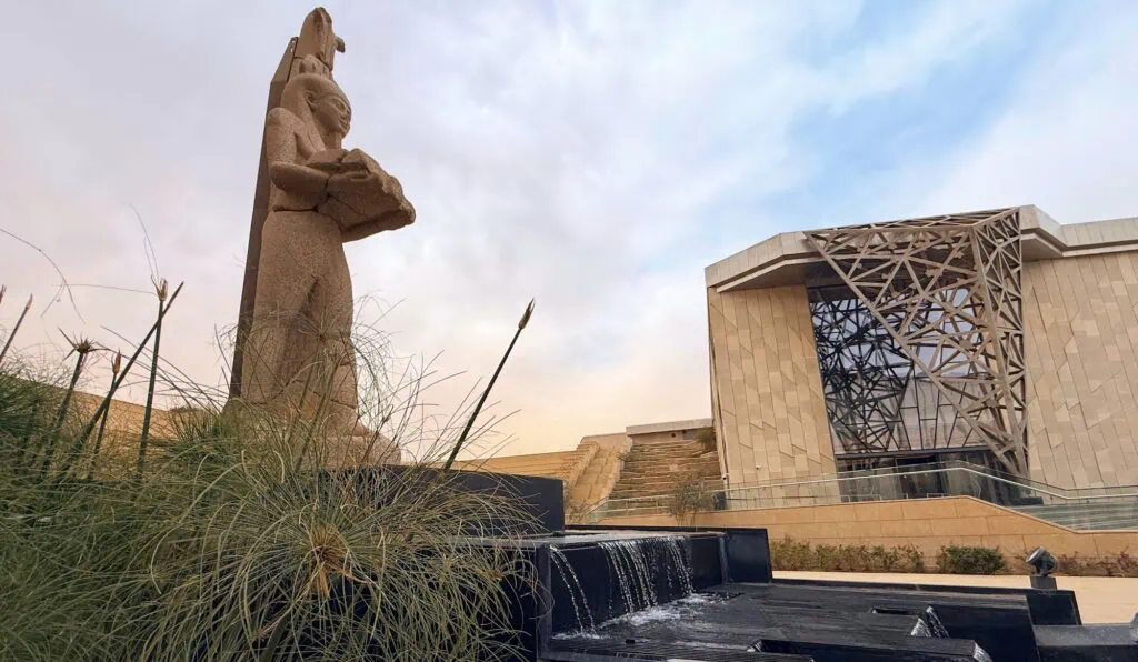 Grand Egyptian Museum Terraced Garden with stepped pathways, landscaped greenery, and museum facade in Giza