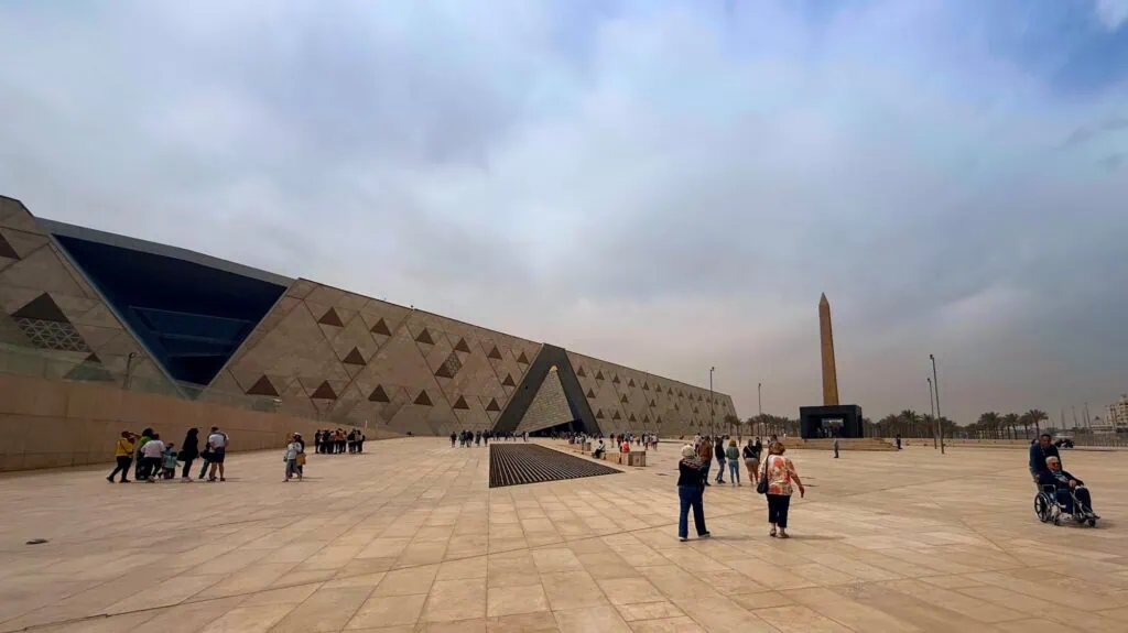 Exterior view of the Grand Egyptian Museum building with modern façade and surrounding open space Cairo