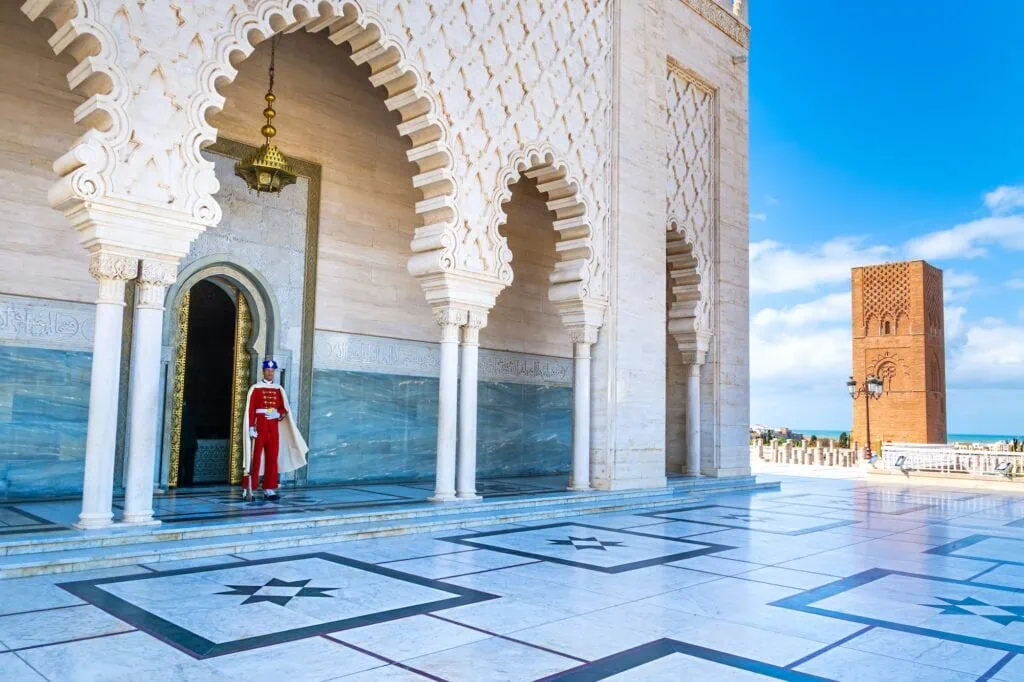 Guard soldier in traditional uniform standing at the entrance of Mausoleum of Mohammed V in Rabat