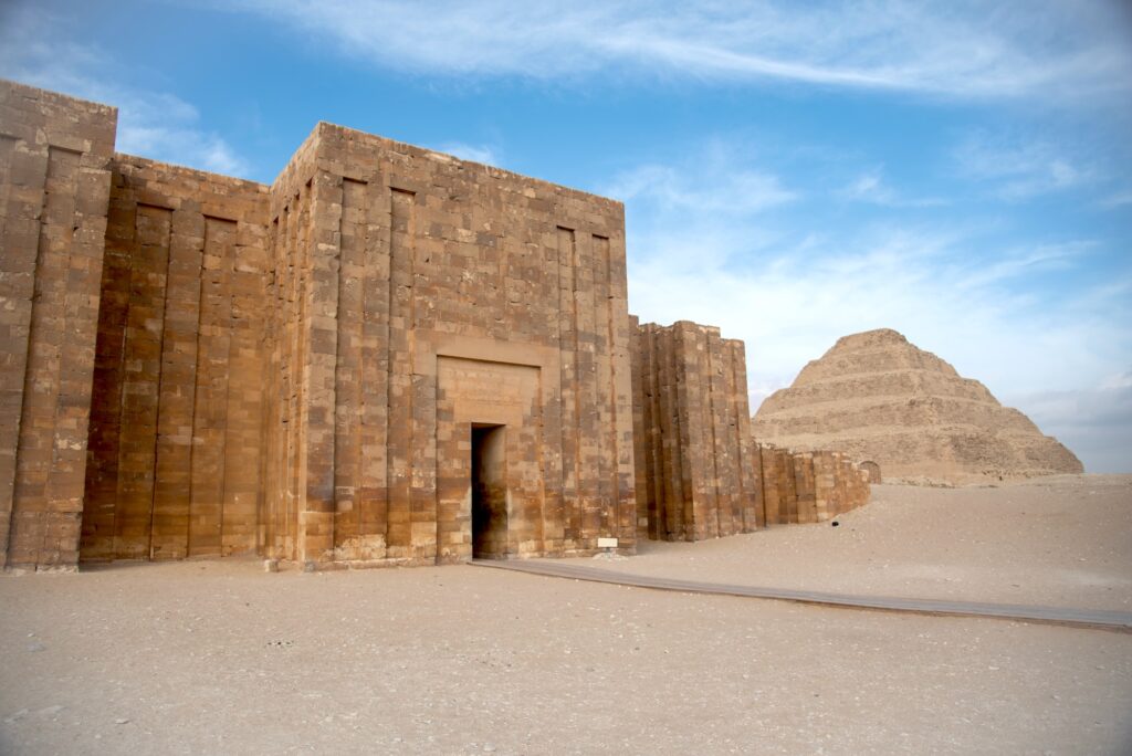 Southeast corner entrance gate with stone walls and passageways at the Step Pyramid complex, Saqqara, Giza